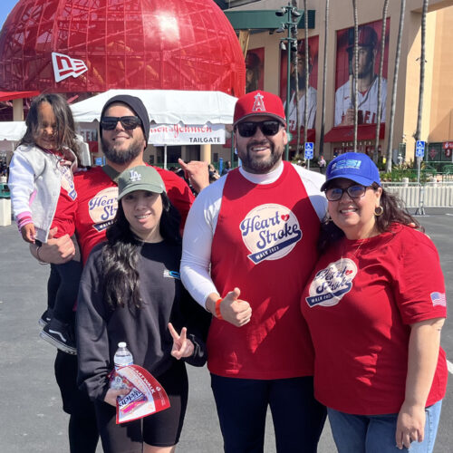 Family posing in front of the Angel's stadium for the Heart Walk 2023
